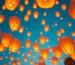 Globos de Cantoya iluminando el cielo durante un evento corporativo