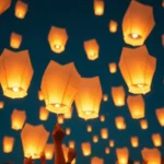 Grupo de personas lanzando globos de Cantoya en un evento corporativo.